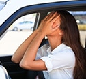 Crying woman in a car